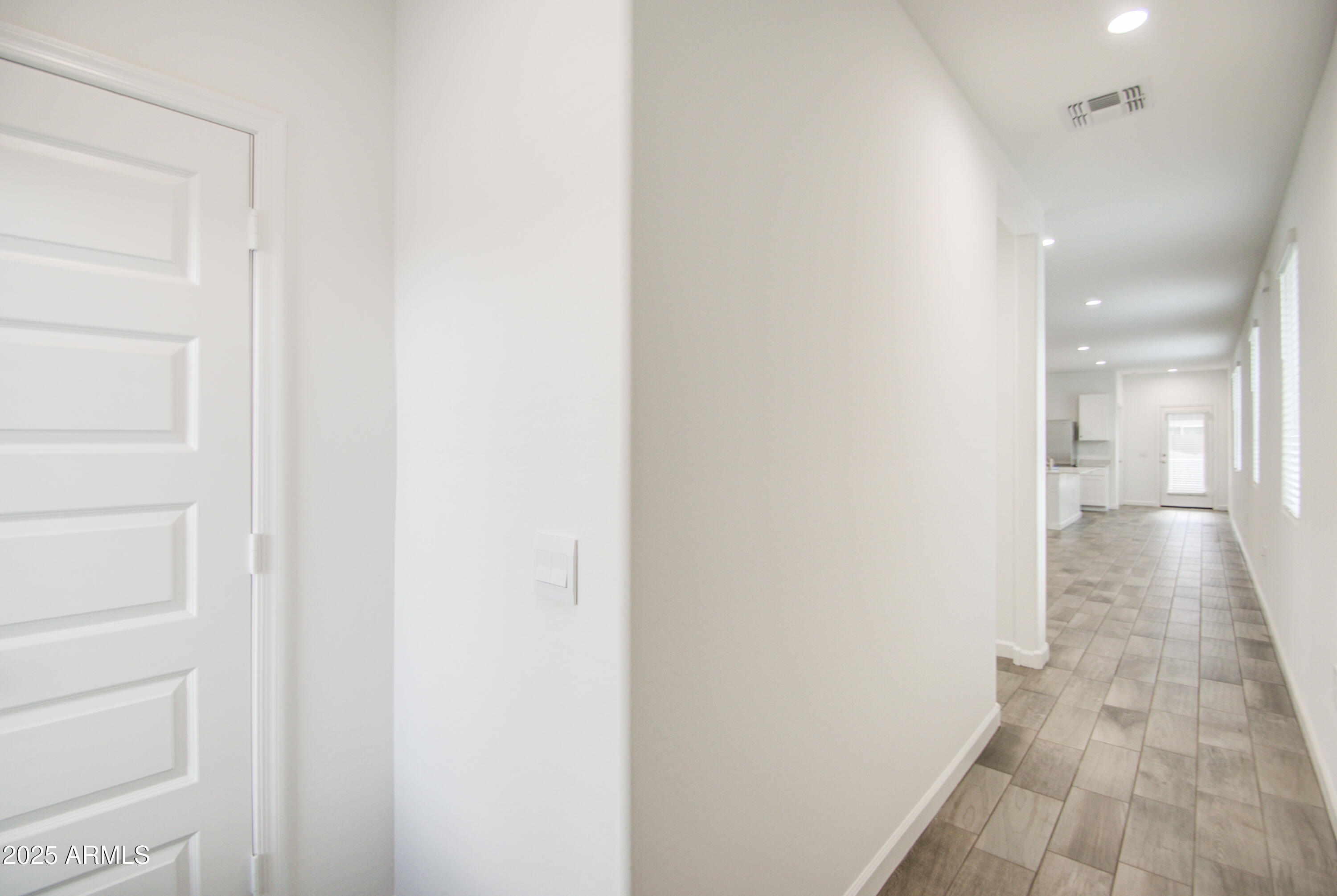 1749 West Stealth Avenue Apache Junction, AZ 85120 - Photo 5 of 48 a view of a hallway with wooden floor