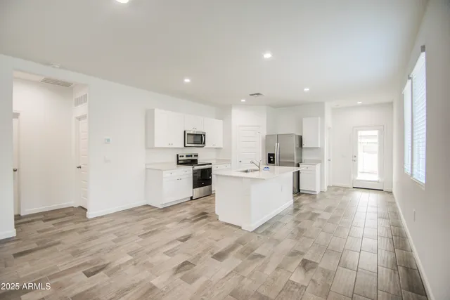 a view of kitchen with wooden floor