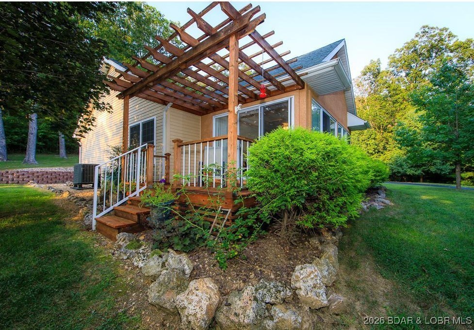 4 Bear Lake Road Eldon, MO 65026 - Photo 11 of 37 So beautiful when spring blooms, and this deck ove