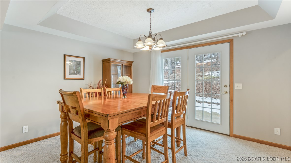 4 Bear Lake Road Eldon, MO 65026 - Photo 12 of 37 Dining area opens to the back patio