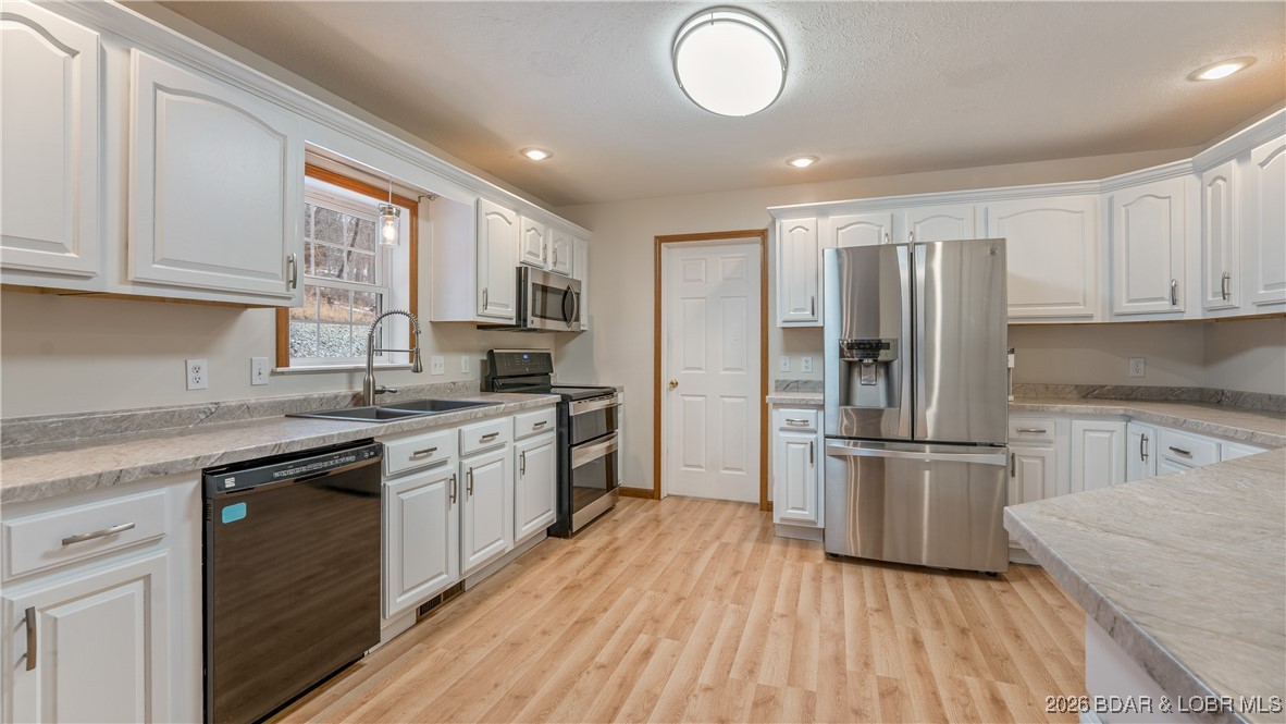 4 Bear Lake Road Eldon, MO 65026 - Photo 14 of 37 Bright updated kitchen features newer appliances,