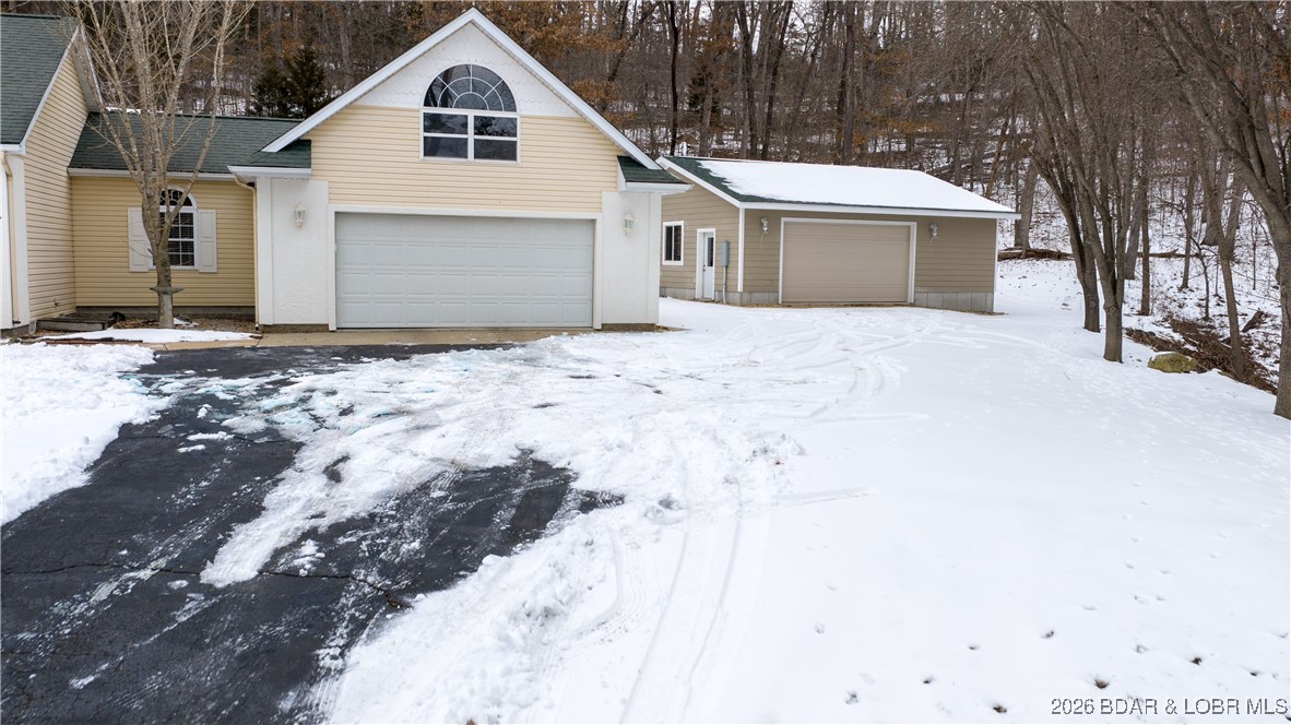 4 Bear Lake Road Eldon, MO 65026 - Photo 32 of 40 Oversized detached garage sits to the right of the