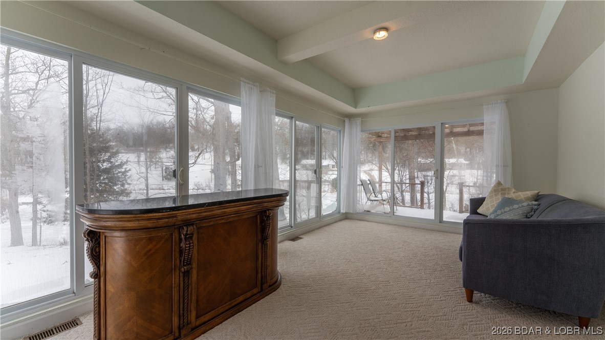 4 Bear Lake Road Eldon, MO 65026 - Photo 10 of 37 Enclosed sun porch overlooks the lake and opens to
