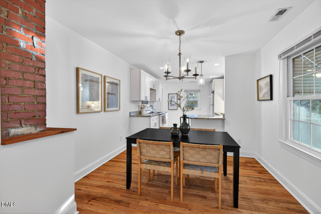 802 Cox Avenue Durham, NC 27701 - Photo 10 of 41 a view of a dining room with furniture and wooden floor