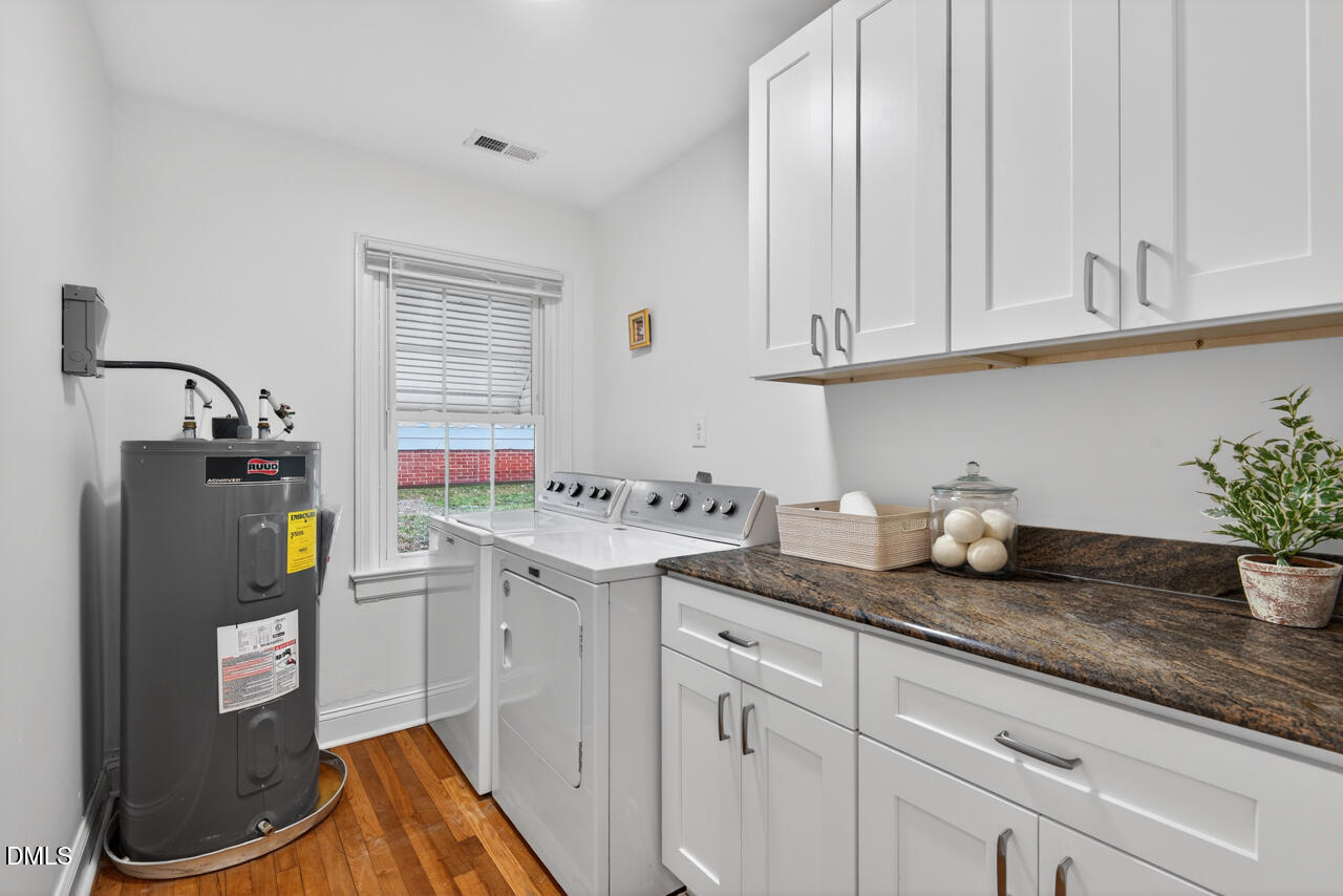 802 Cox Avenue Durham, NC 27701 - Photo 29 of 41 a kitchen with granite countertop a sink stainless steel appliances and cabinets