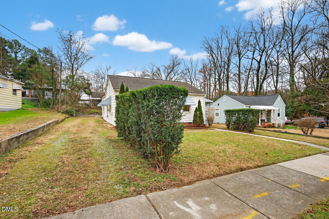 802 Cox Avenue Durham, NC 27701 - Photo 32 of 41 a view of a yard with plants and a fountain
