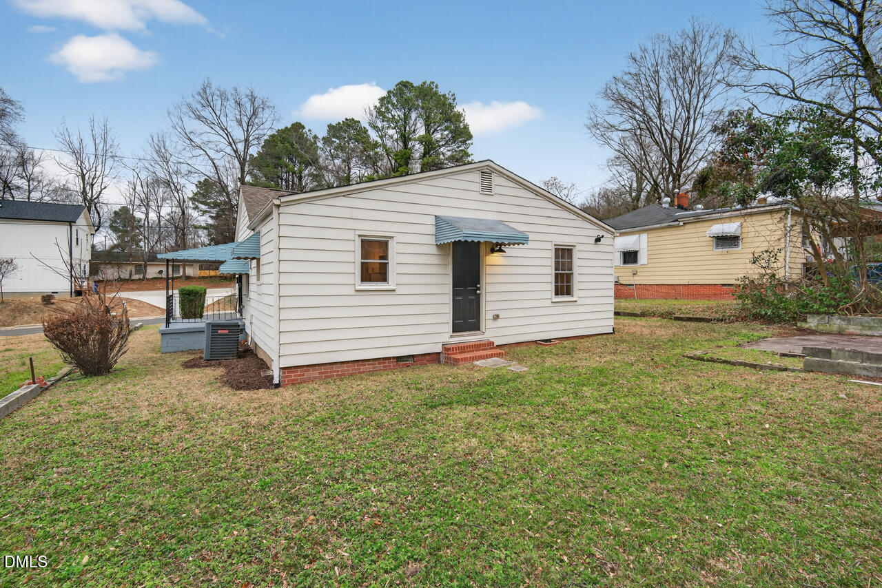 802 Cox Avenue Durham, NC 27701 - Photo 34 of 41 a view of a backyard with a garden and entertaining space