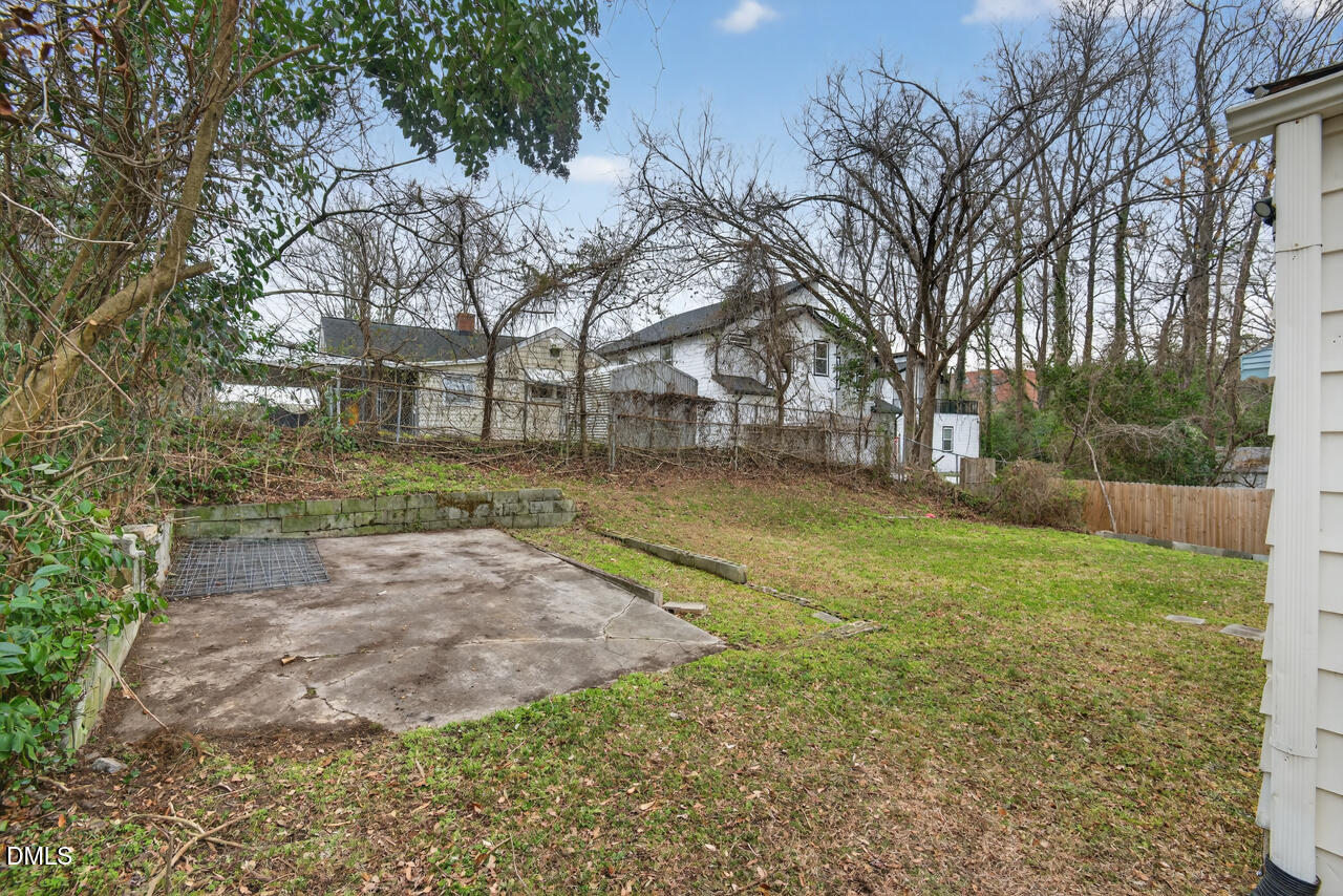 802 Cox Avenue Durham, NC 27701 - Photo 36 of 41 a view of a yard with a house in the background