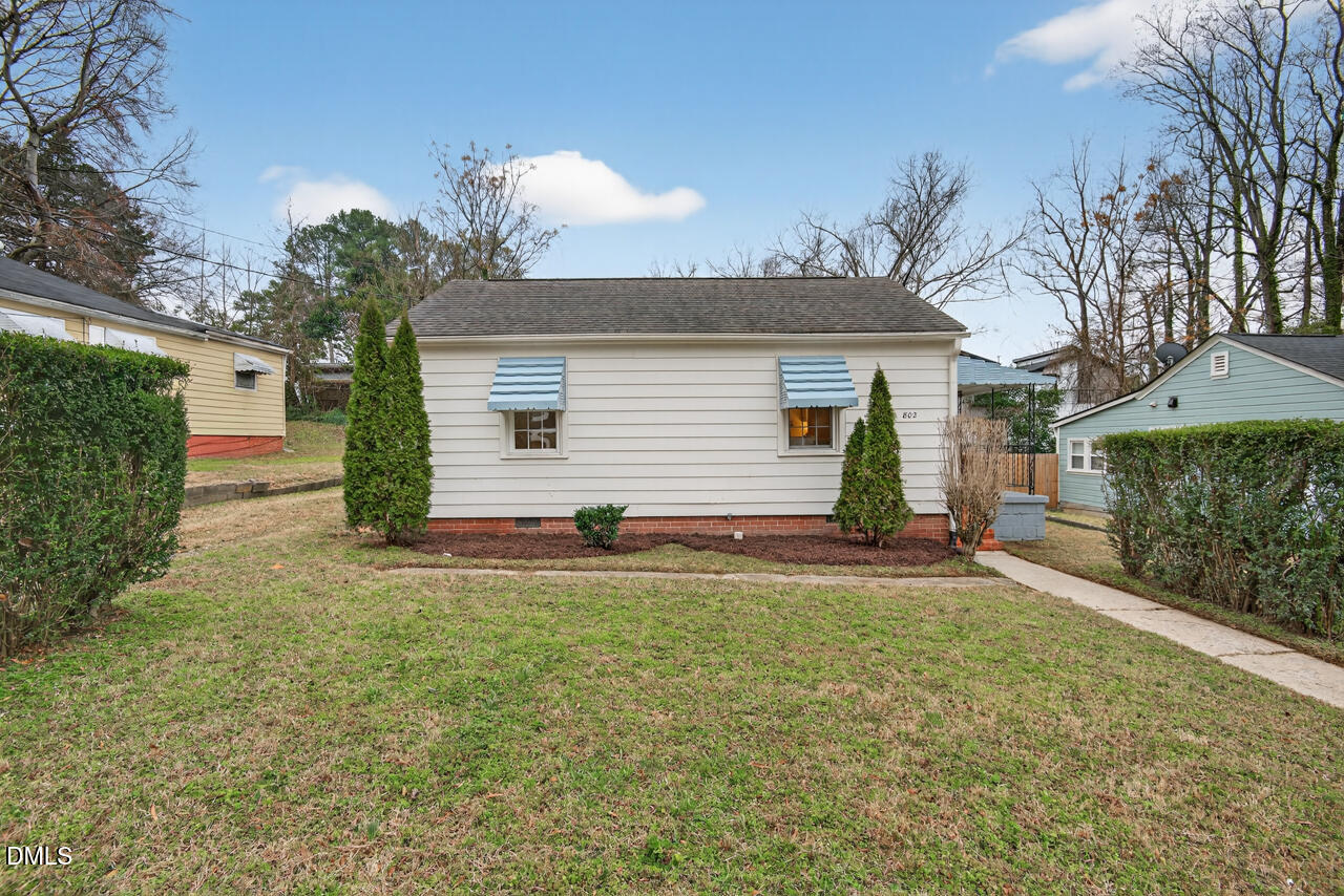 802 Cox Avenue Durham, NC 27701 - Photo 38 of 41 a view of a backyard with a garden and entertaining space