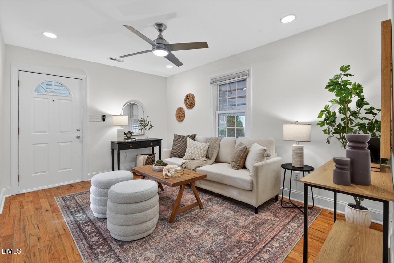 802 Cox Avenue Durham, NC 27701 - Photo 4 of 41 a living room with furniture and a potted plant