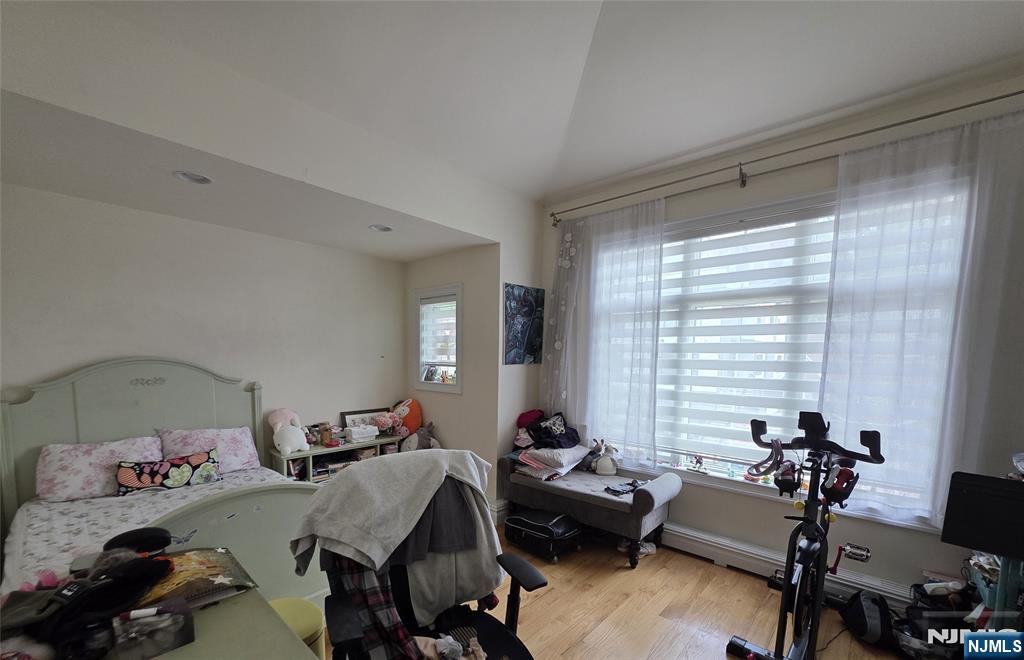527 Roff Avenue, Unit B Palisades Park, NJ 07650 - Photo 10 of 11 a bedroom with furniture and a window