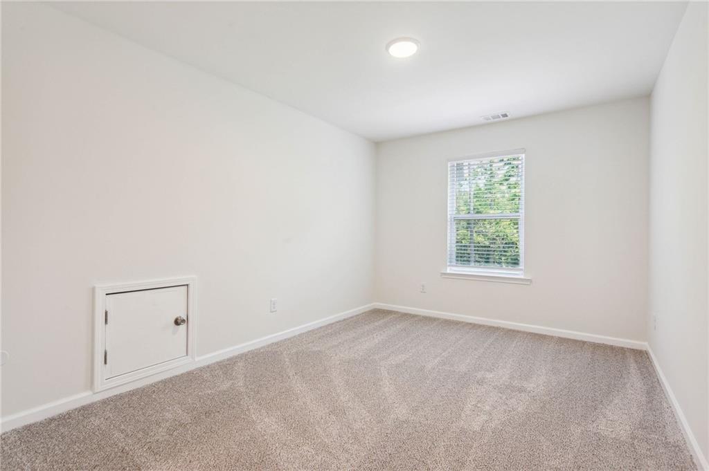 425 Boynton Road Hampton, GA 30228 - Photo 41 of 53 an empty room with a window