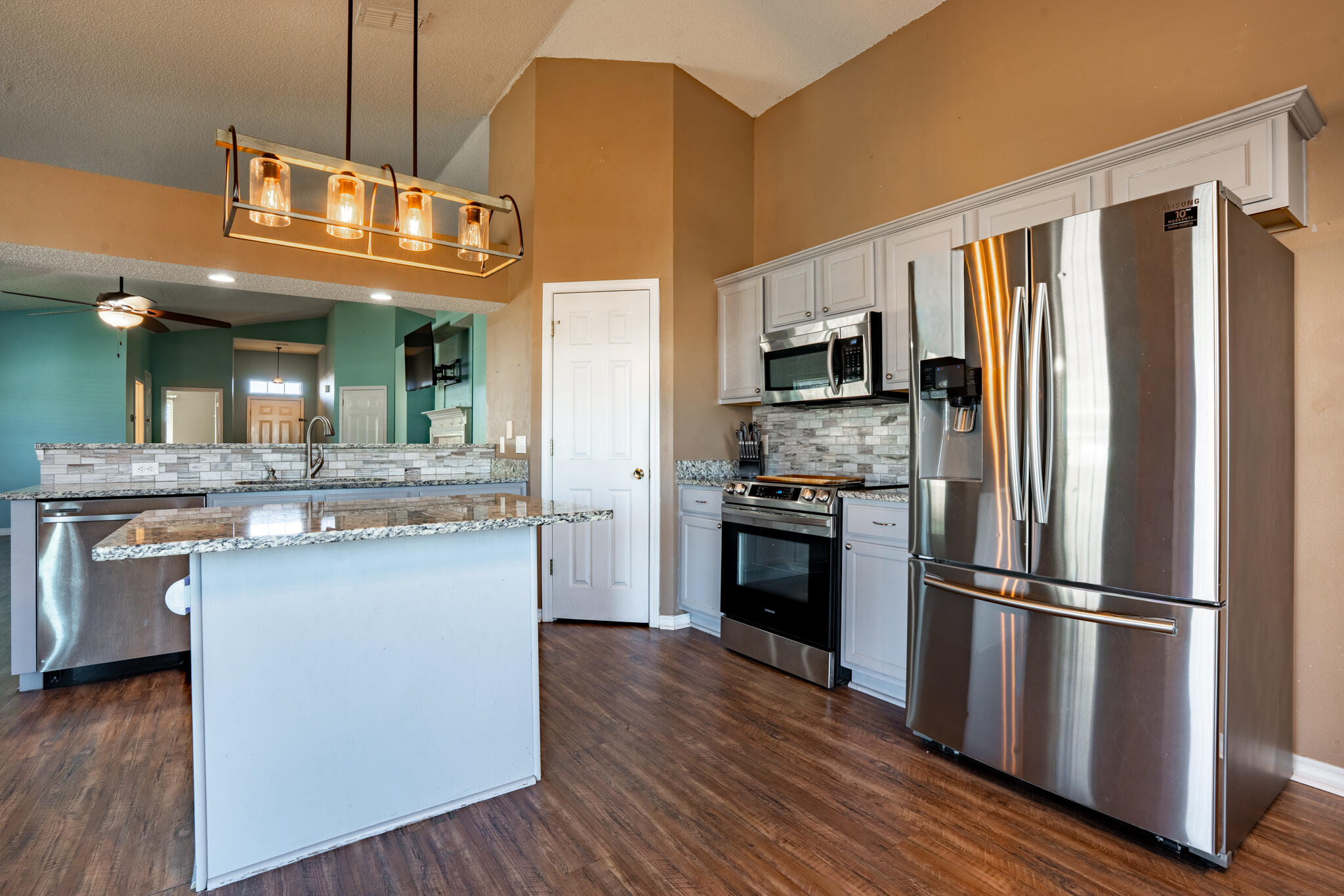104 Sandstone Trail Crestview, FL 32539 - Photo 14 of 41 a kitchen with stainless steel appliances a refrigerator and a stove top oven