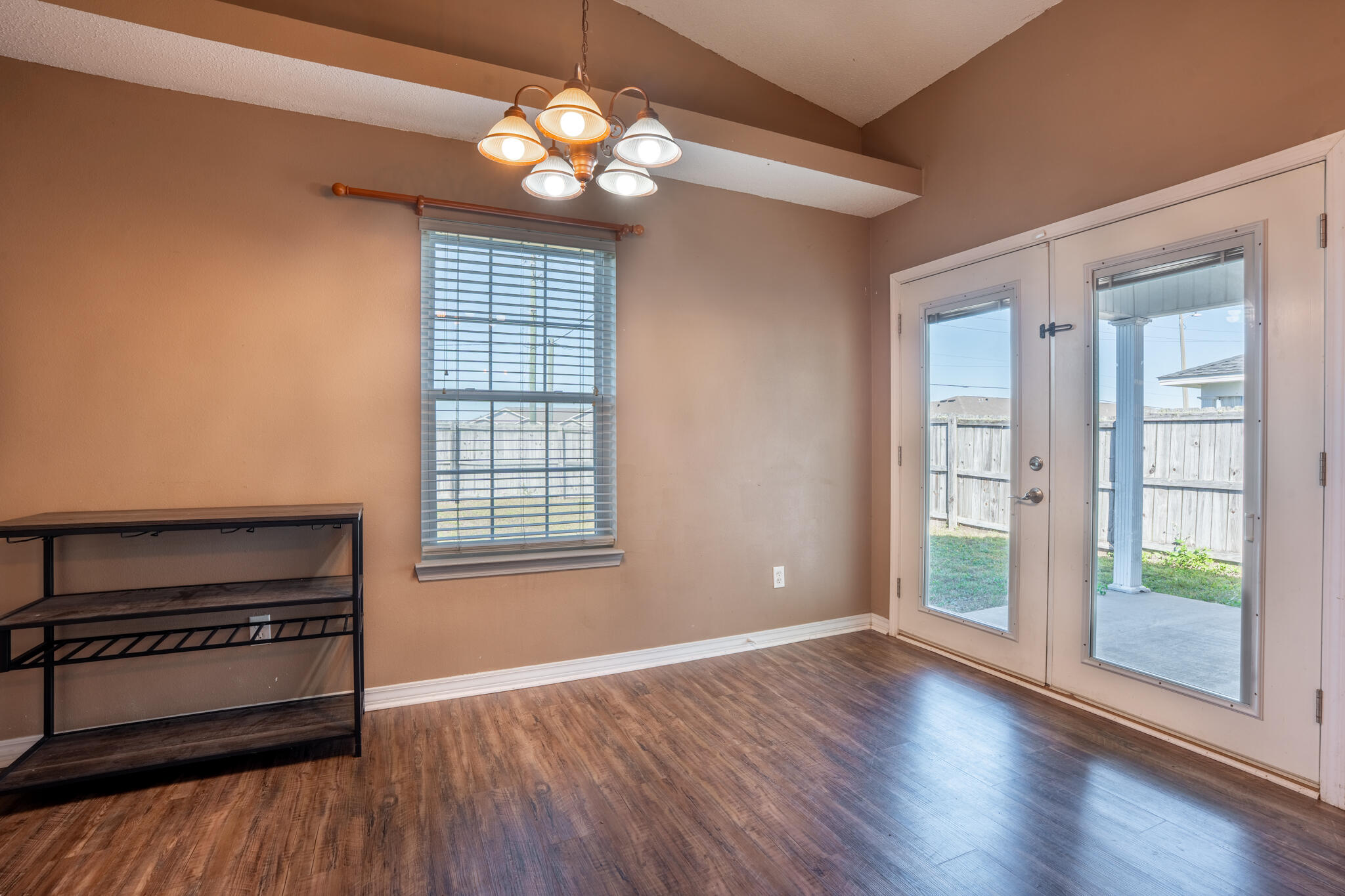 104 Sandstone Trail Crestview, FL 32539 - Photo 15 of 41 a view of an empty room with wooden floor and a window