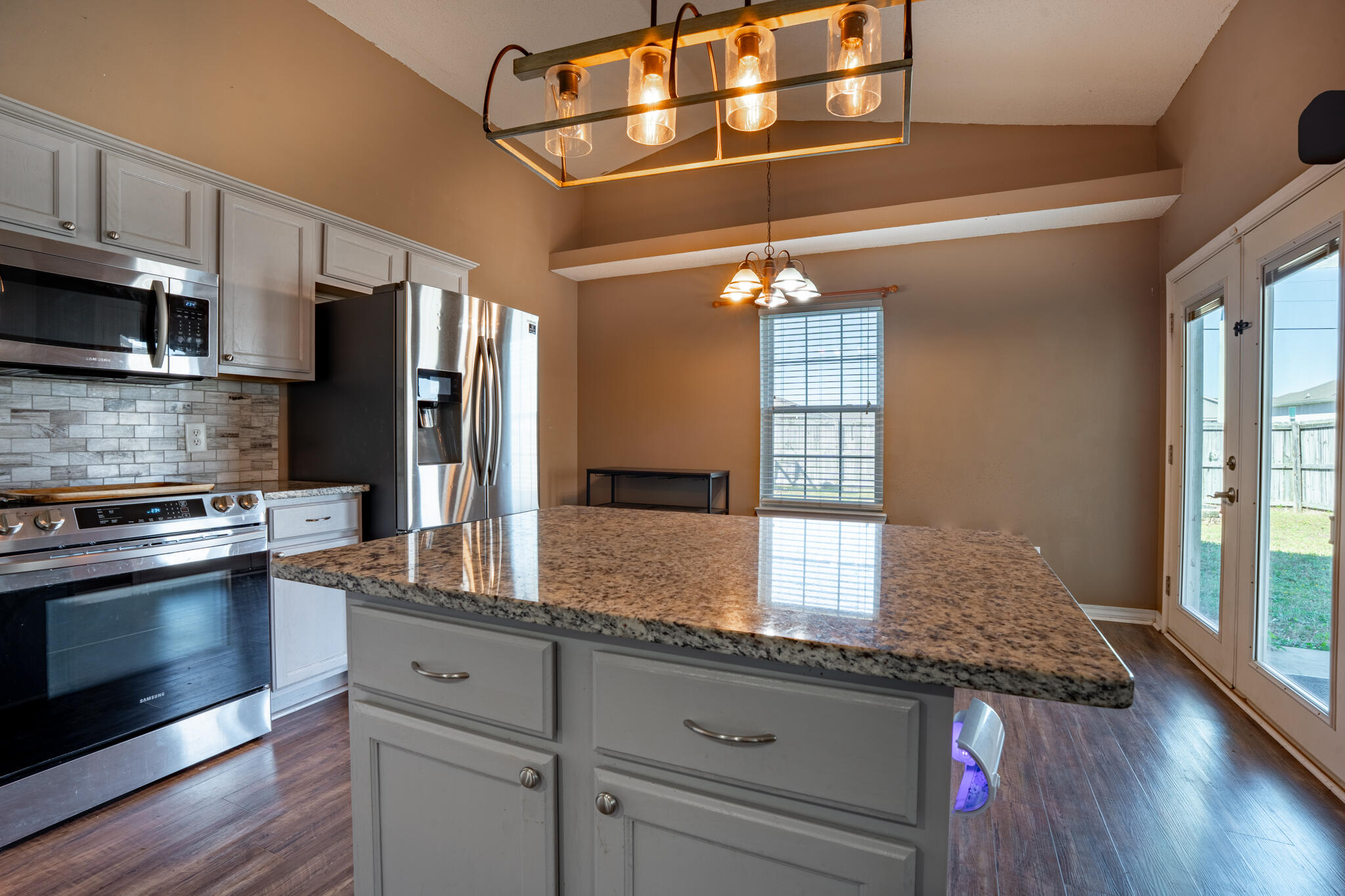 104 Sandstone Trail Crestview, FL 32539 - Photo 17 of 41 a kitchen with stainless steel appliances granite countertop a sink stove and refrigerator
