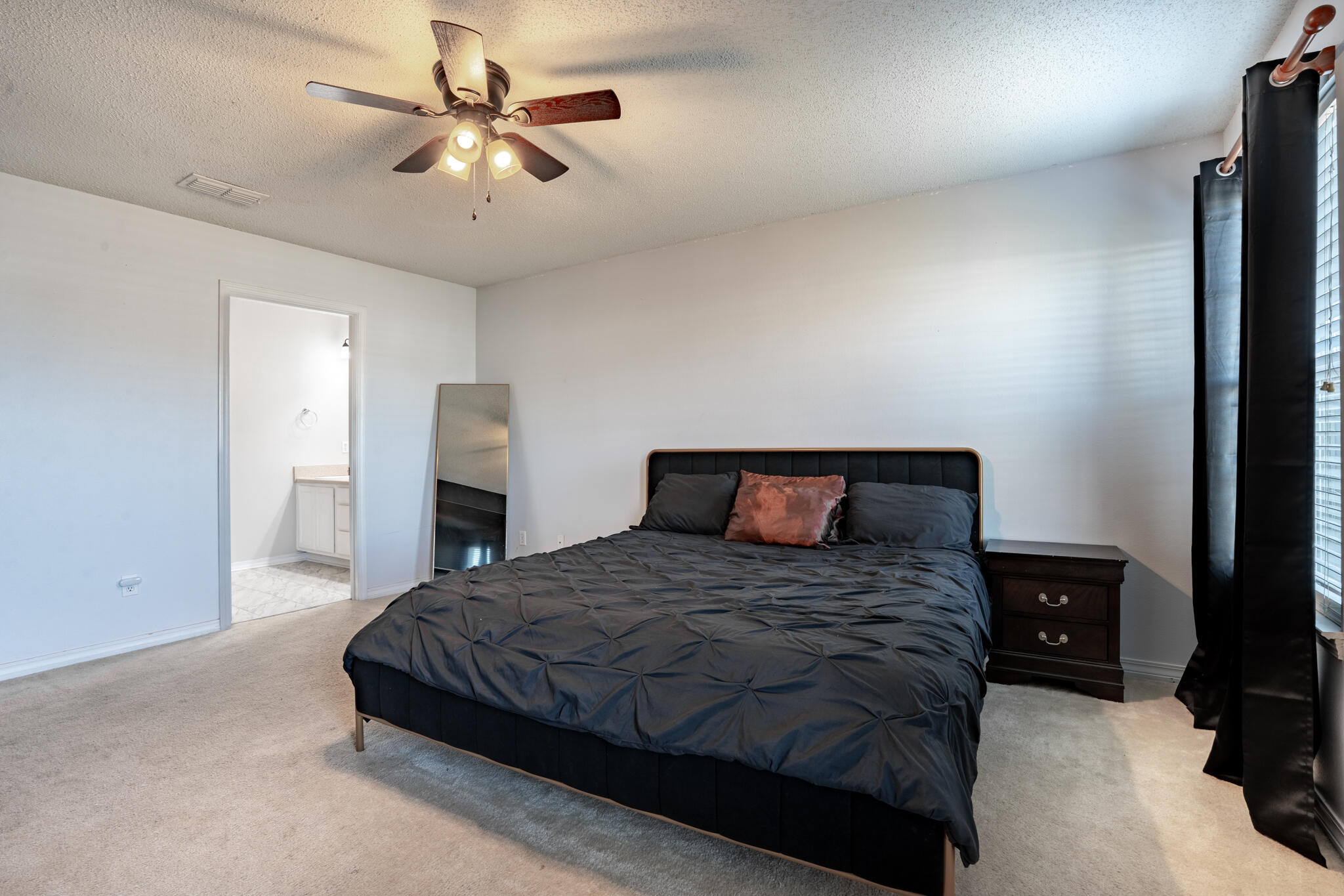104 Sandstone Trail Crestview, FL 32539 - Photo 19 of 41 a bedroom with a bed and a ceiling fan