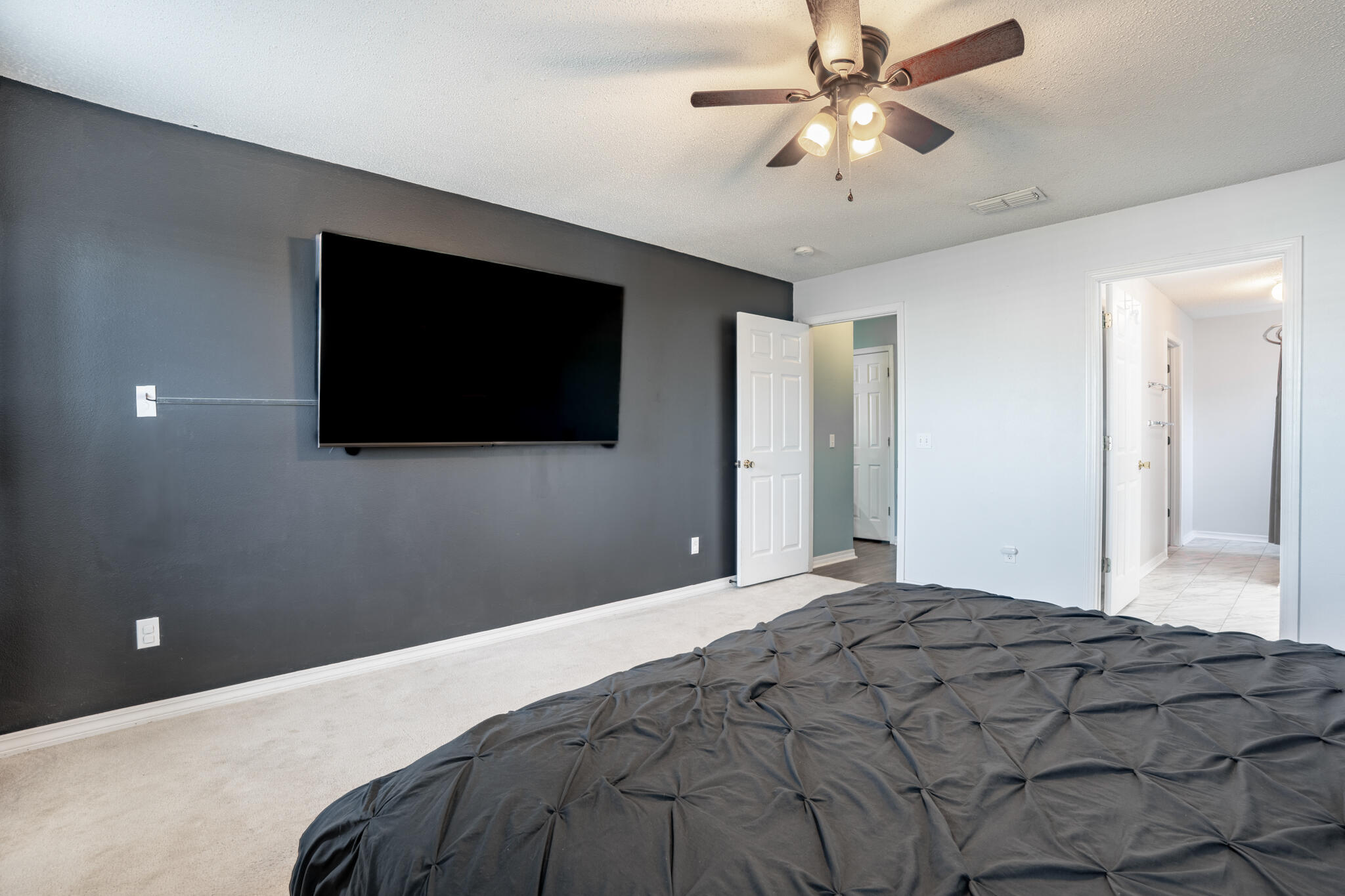 104 Sandstone Trail Crestview, FL 32539 - Photo 20 of 41 a bedroom with a bed and a flat screen tv