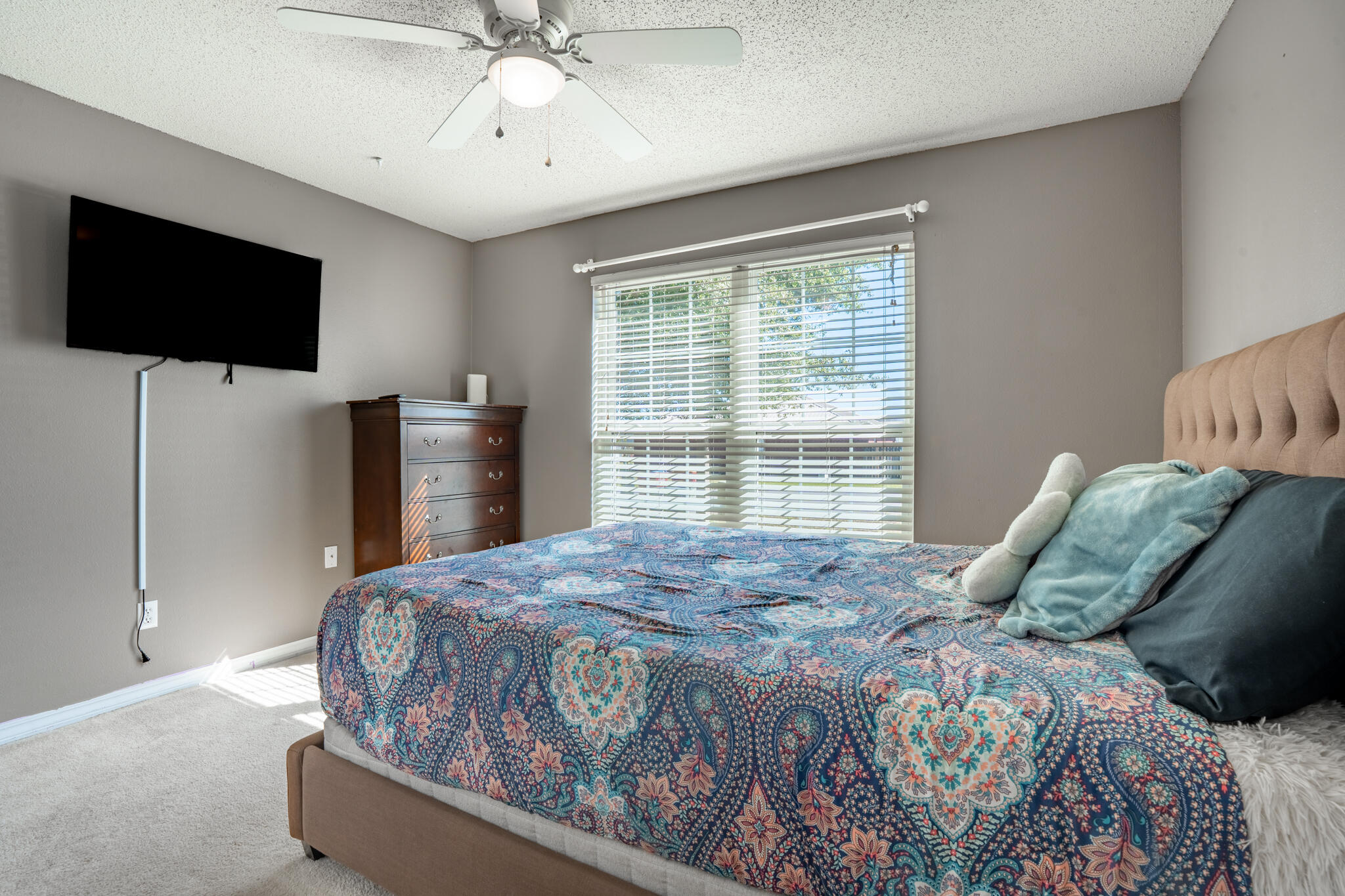 104 Sandstone Trail Crestview, FL 32539 - Photo 31 of 41 a bedroom with a bed tv and a window