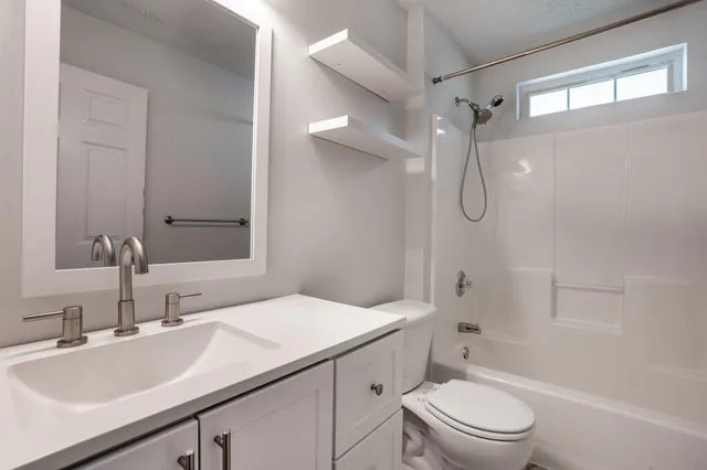 a bathroom with a glass shower door