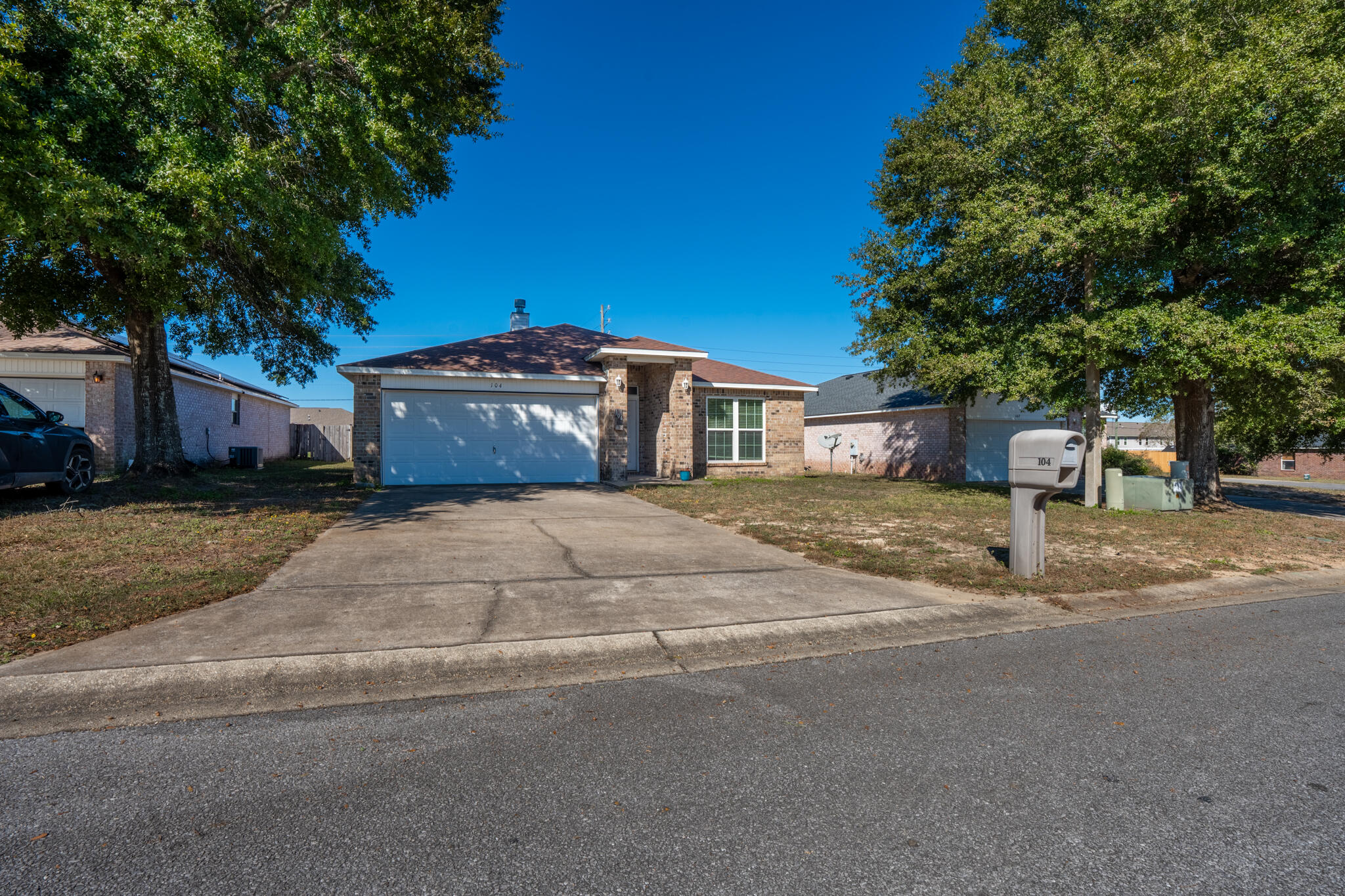104 Sandstone Trail Crestview, FL 32539 - Photo 4 of 41 a front view of a house with a yard and garage