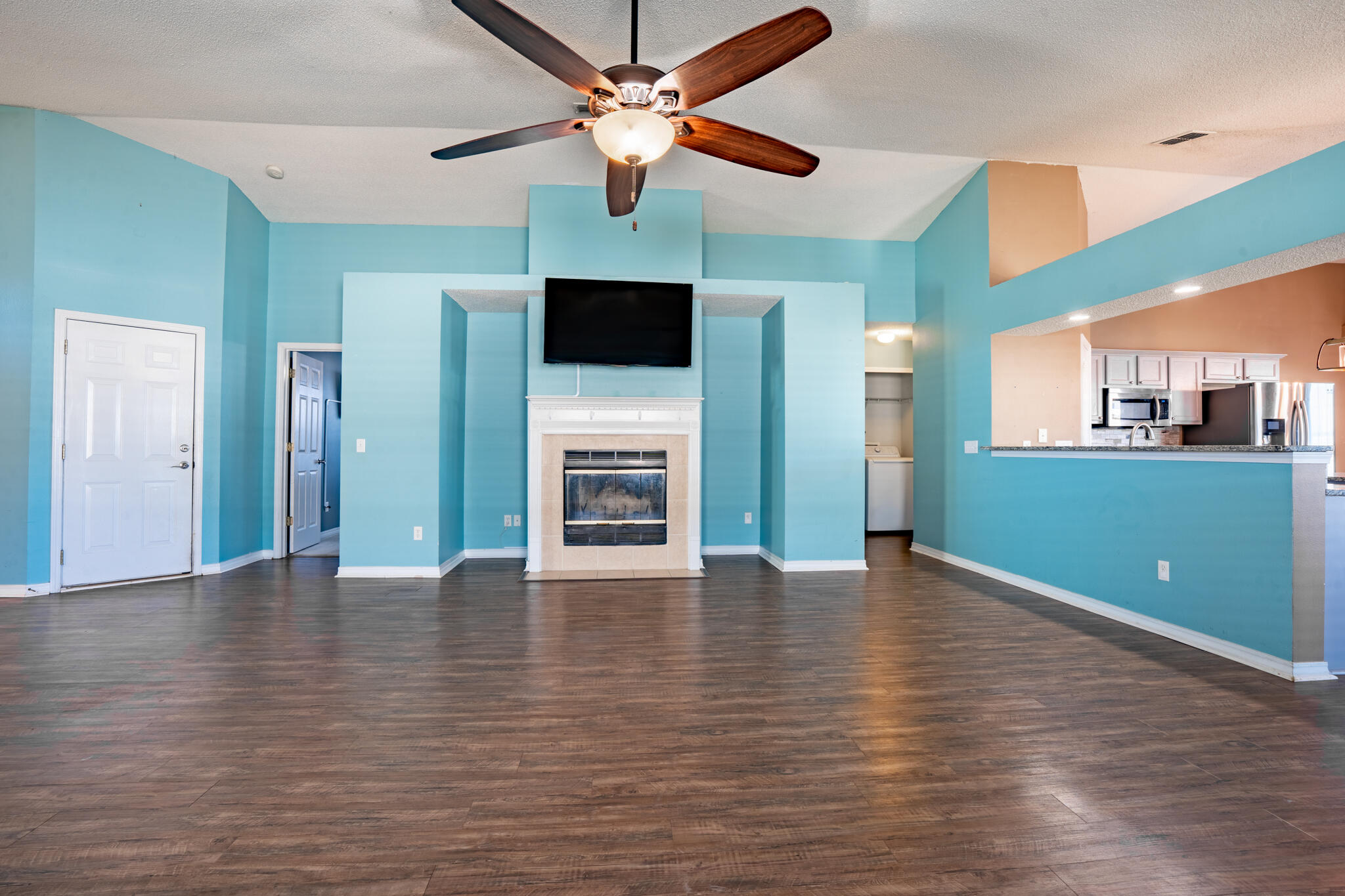 104 Sandstone Trail Crestview, FL 32539 - Photo 10 of 41 a view of an empty room with window and wooden floor