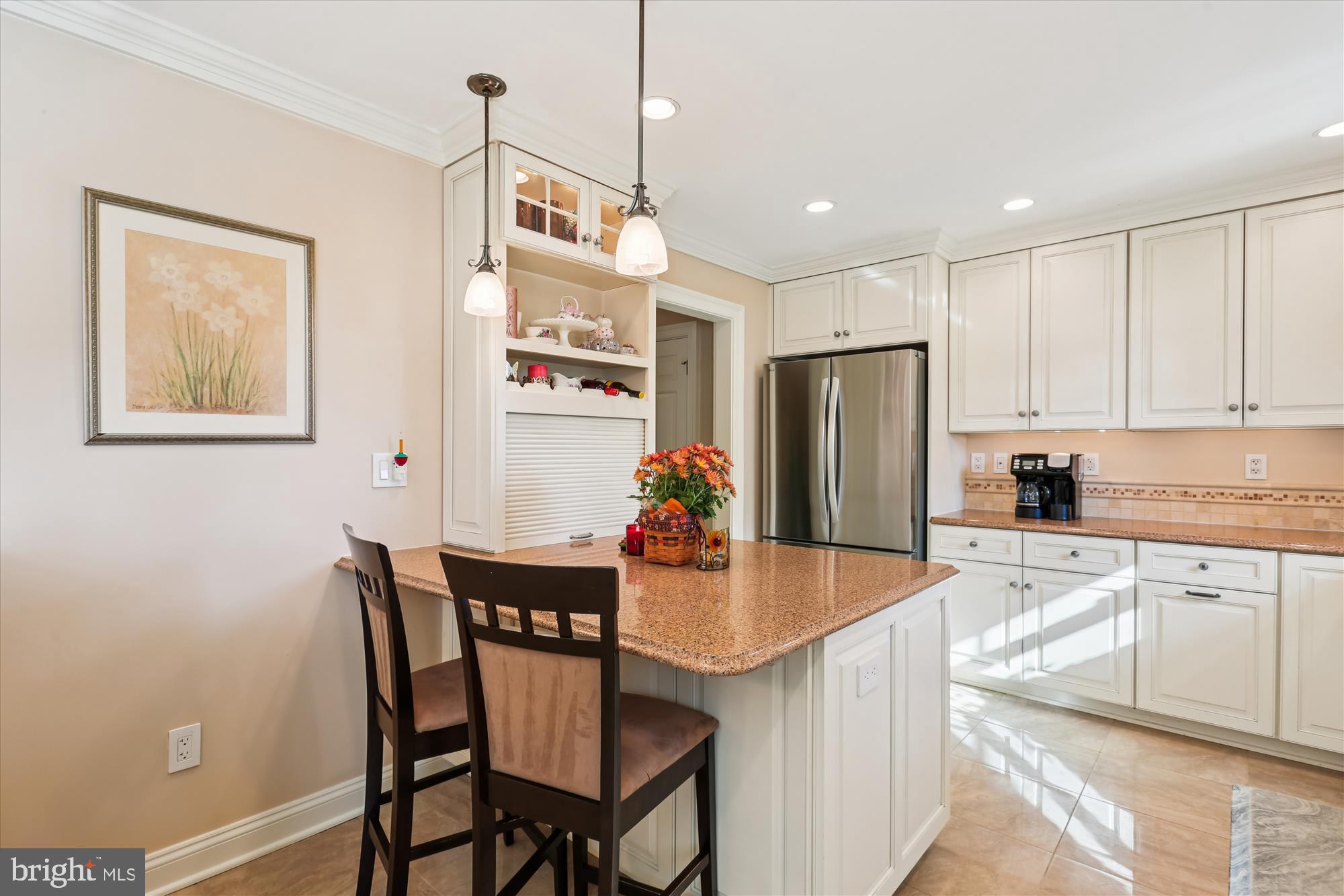 19321 Olney Mill Road Olney, MD 20832 - Photo 16 of 91 a kitchen with stainless steel appliances granite countertop a dining table chairs refrigerator and microwave