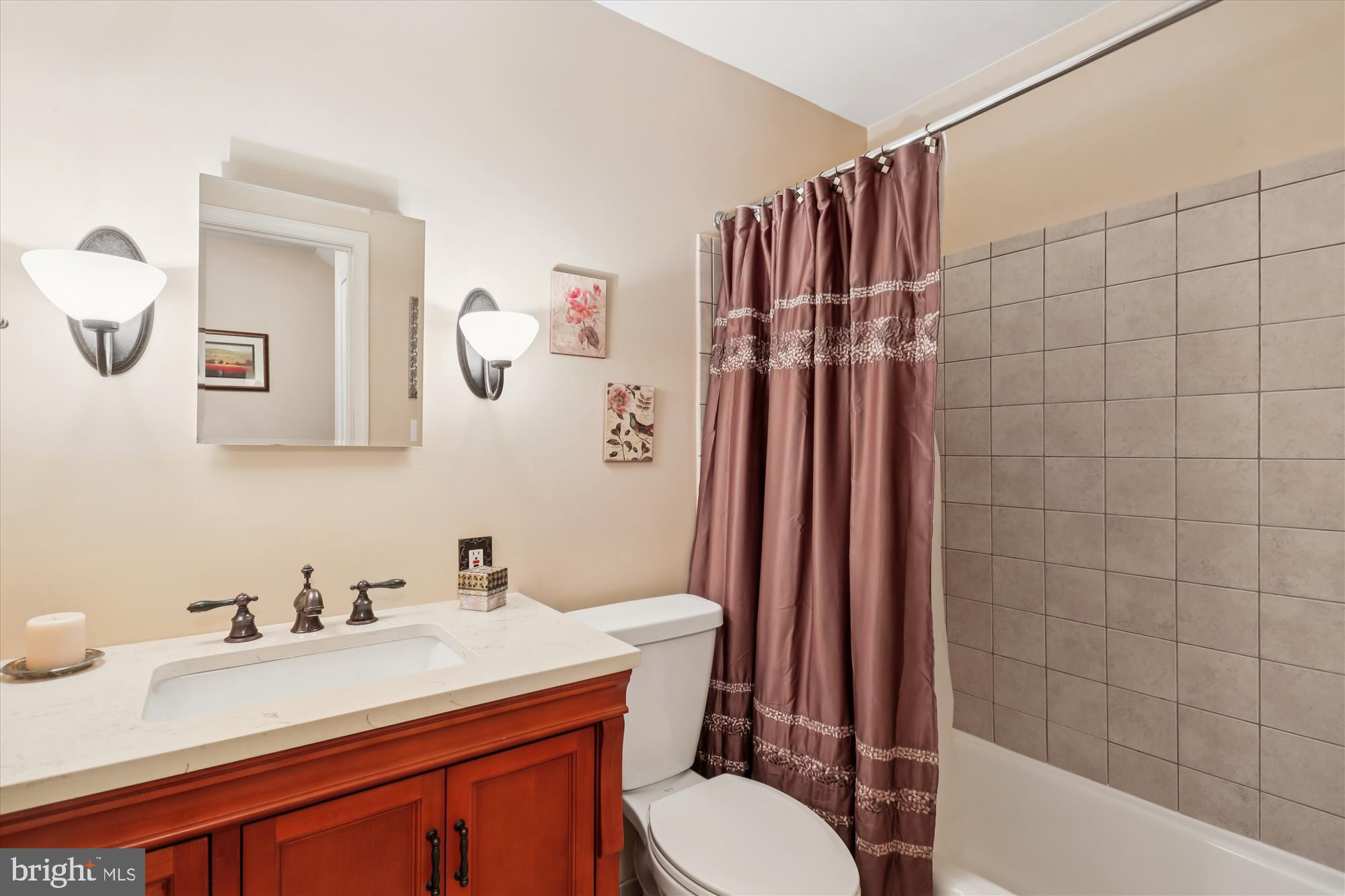 19321 Olney Mill Road Olney, MD 20832 - Photo 26 of 91 a bathroom with a granite countertop sink mirror vanity and toilet