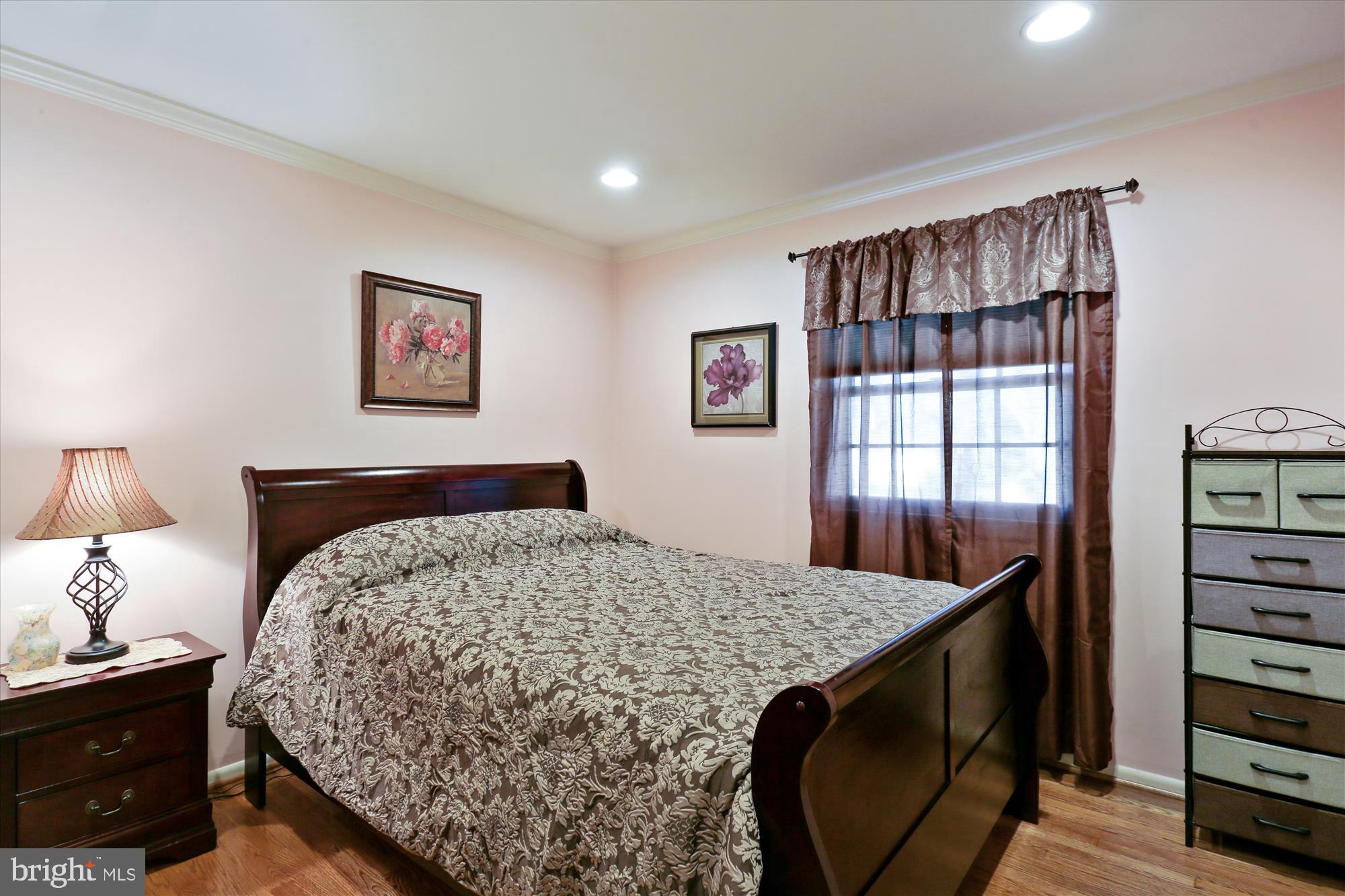 19321 Olney Mill Road Olney, MD 20832 - Photo 27 of 91 a bedroom with a bed and dresser