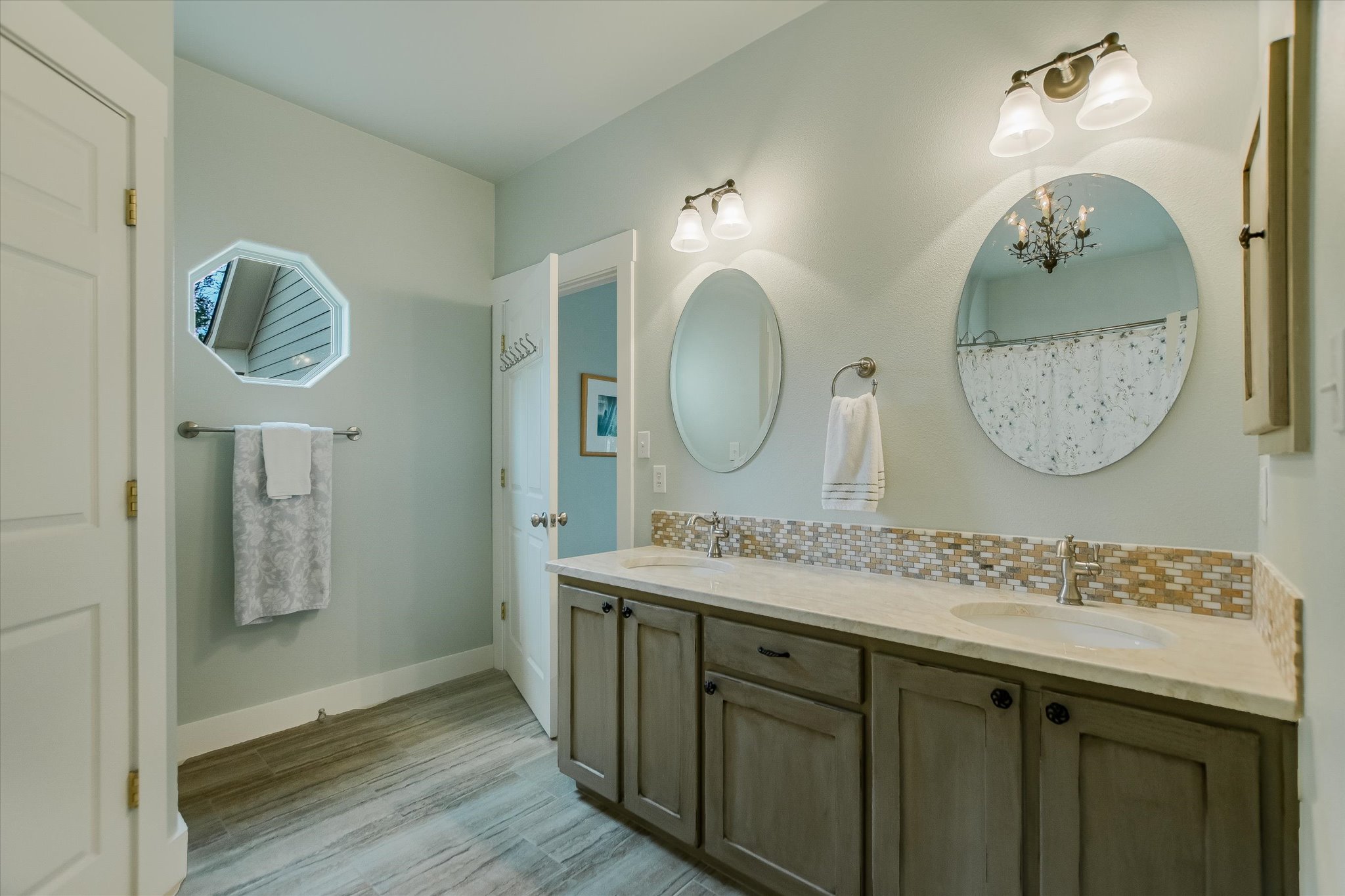 590 Rancho Grande Drive Wimberley, TX 78676 - Photo 19 of 30 a bathroom with a sink and a mirror