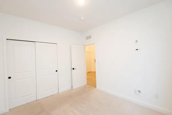 a view of a storage & utility room with stairs