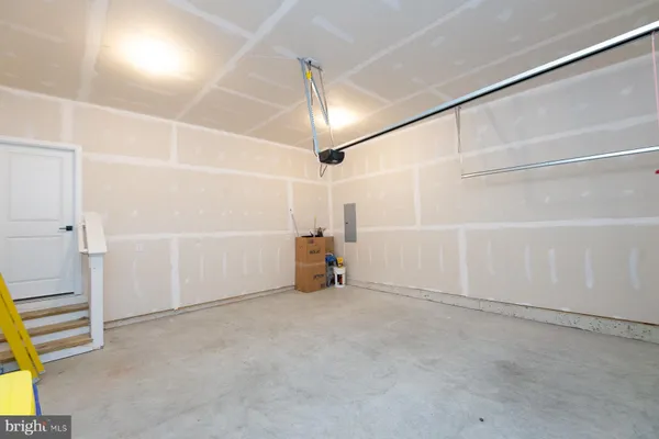 a view of empty room with a fireplace