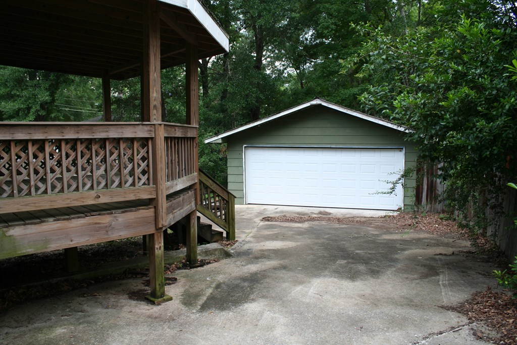 2511 Reese Road Columbus, GA 31907 - Photo 13 of 31 a view of backyard with wooden fence and a large tree