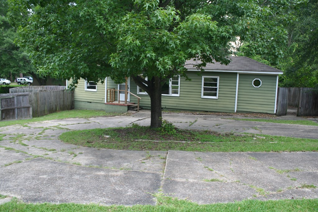 2511 Reese Road Columbus, GA 31907 - Photo 16 of 31 a view of a yard with a house and a large tree