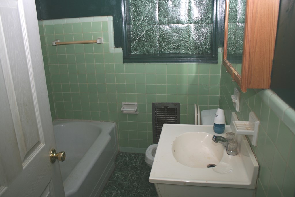 2511 Reese Road Columbus, GA 31907 - Photo 31 of 31 a bathroom with a sink and mirror