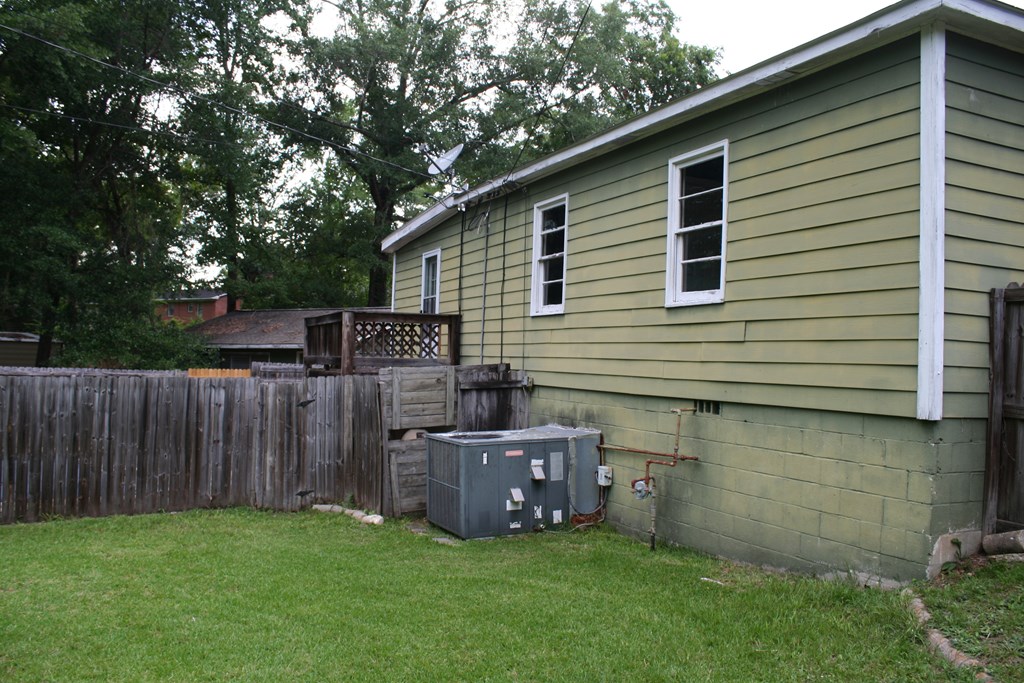 2511 Reese Road Columbus, GA 31907 - Photo 6 of 31 a view of backyard with wooden fence and a large tree
