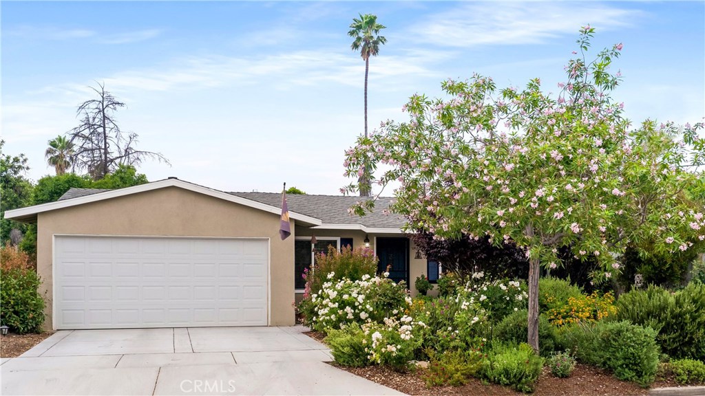 4705 Merrill Avenue Riverside, CA 92506 - Photo 1 of 1 a front view of a house with a yard