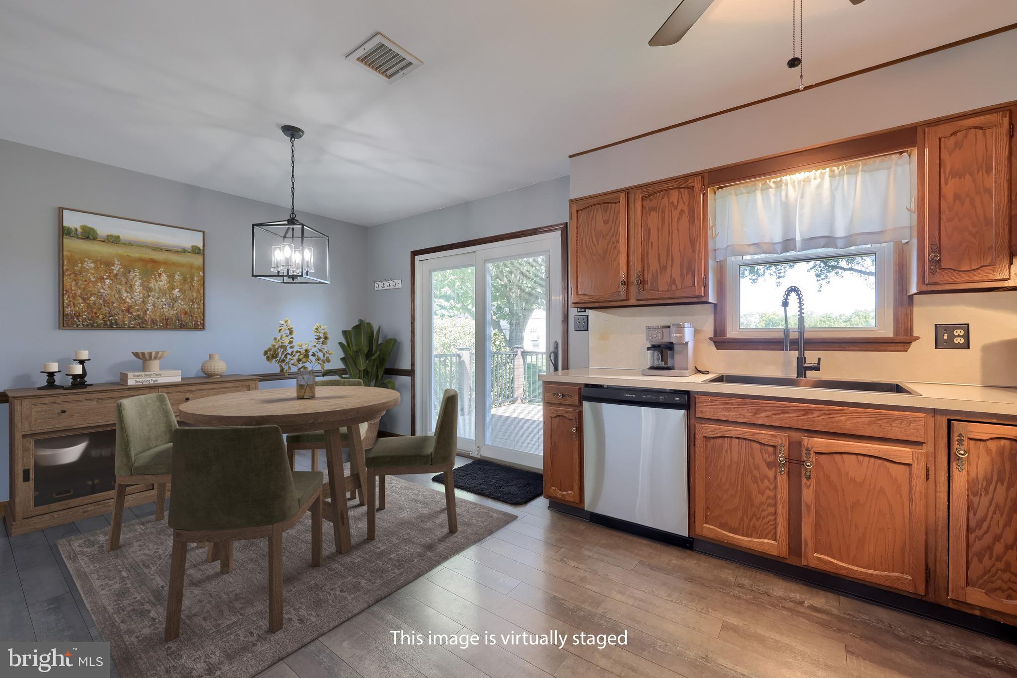 127 West Lexington Road Lititz, PA 17543 - Photo 11 of 48 a kitchen with cabinets a sink dining table and chairs