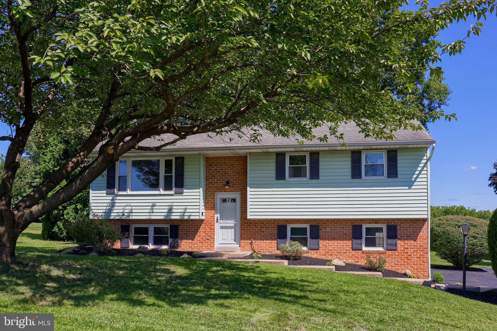 127 West Lexington Road Lititz, PA 17543 - Photo 36 of 48 a front view of a house with a garden and plants