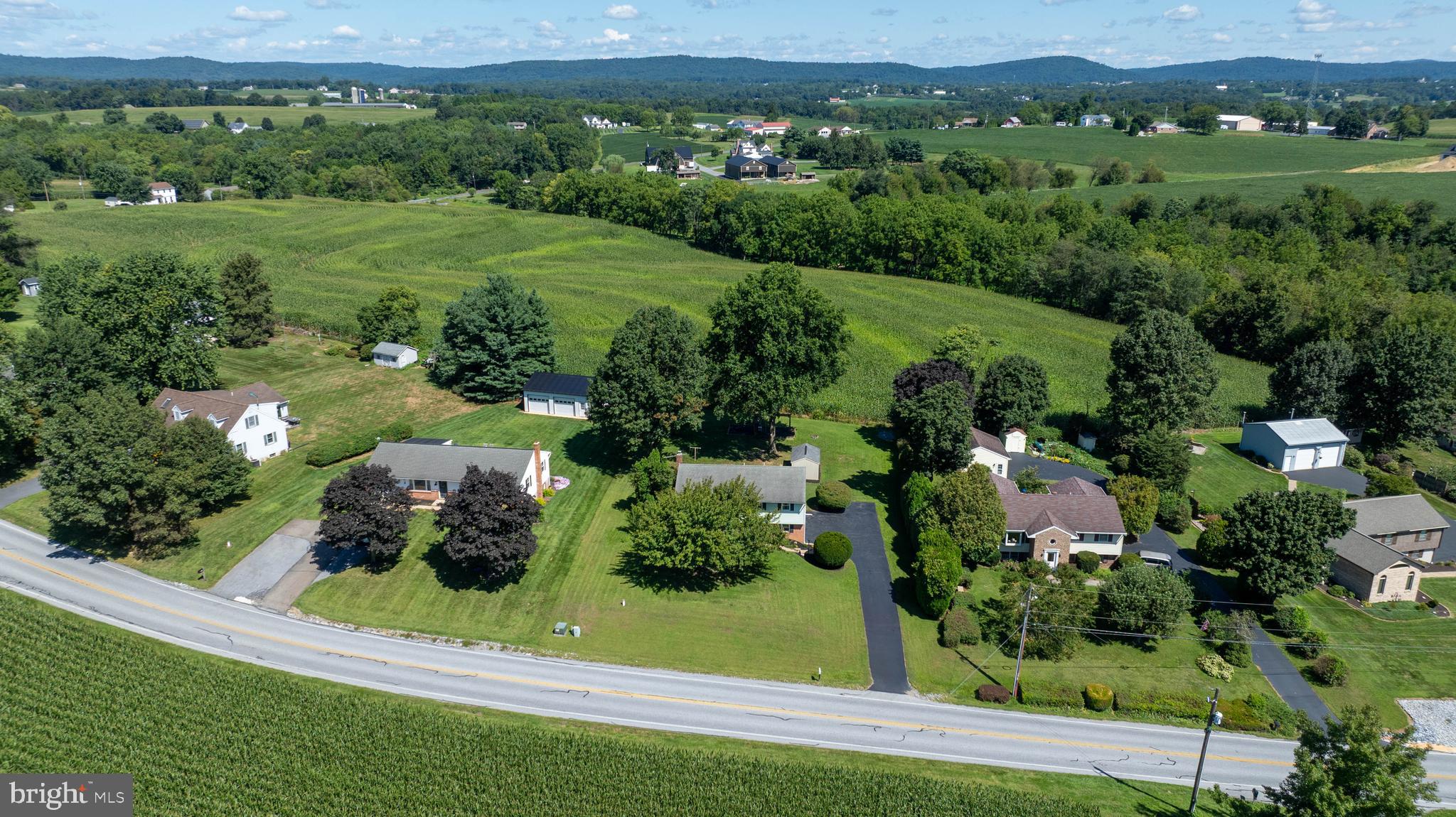 127 West Lexington Road Lititz, PA 17543 - Photo 40 of 48 an aerial view of green landscape with trees houses and mountain view