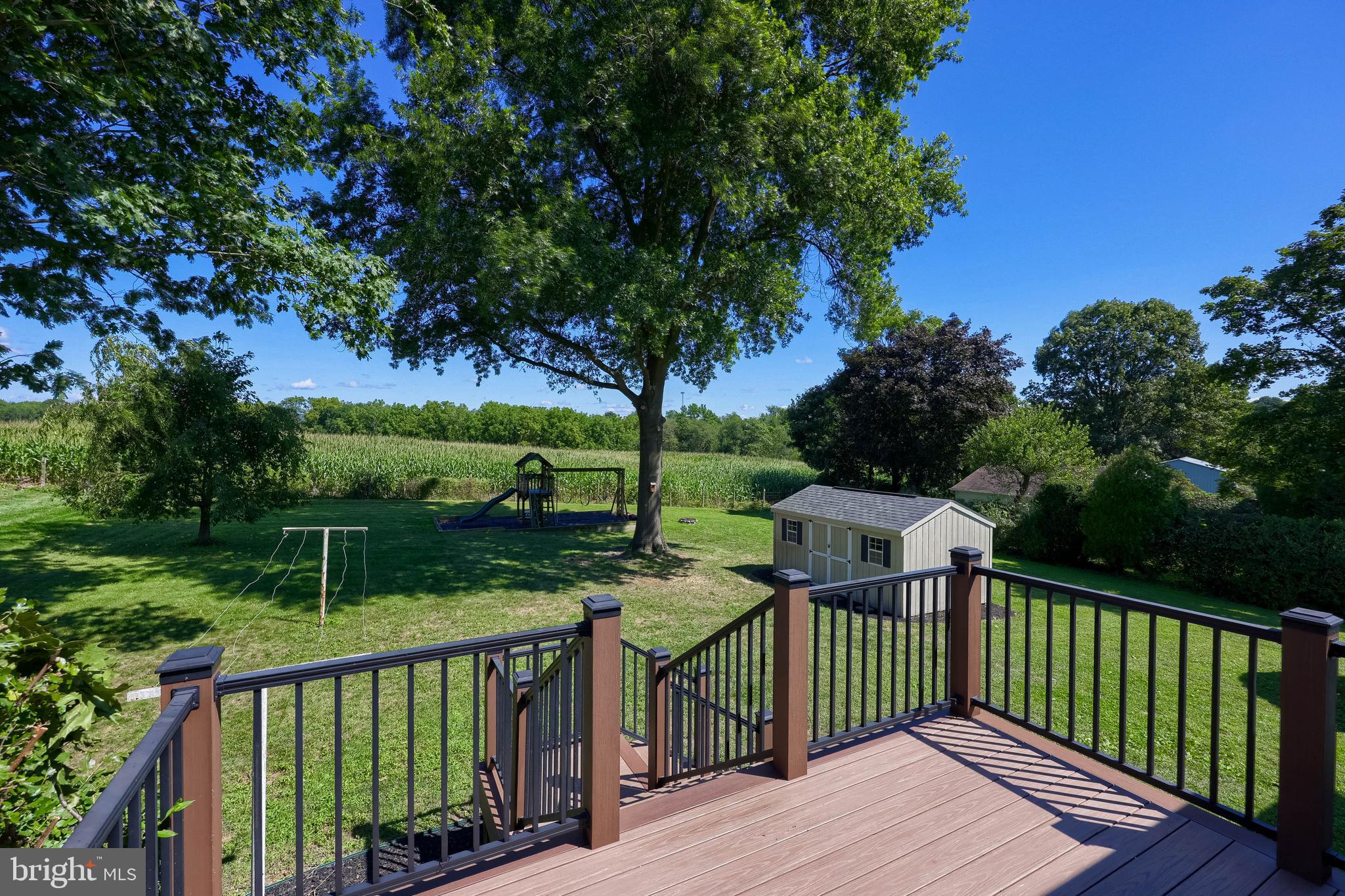 127 West Lexington Road Lititz, PA 17543 - Photo 4 of 48 a view of a deck with a table and chairs under an umbrella