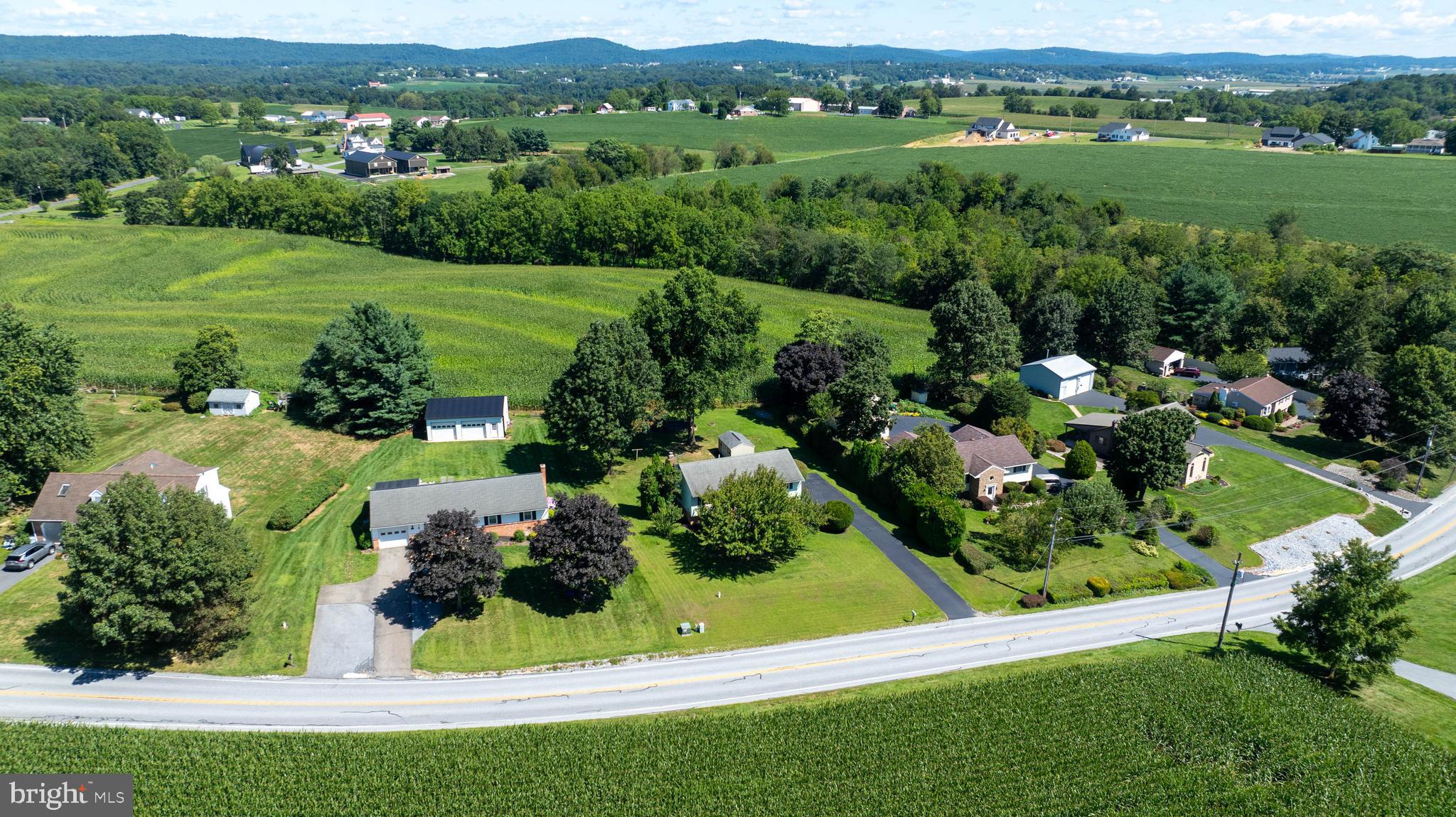 127 West Lexington Road Lititz, PA 17543 - Photo 45 of 48 an aerial view of green landscape with trees houses and mountain view
