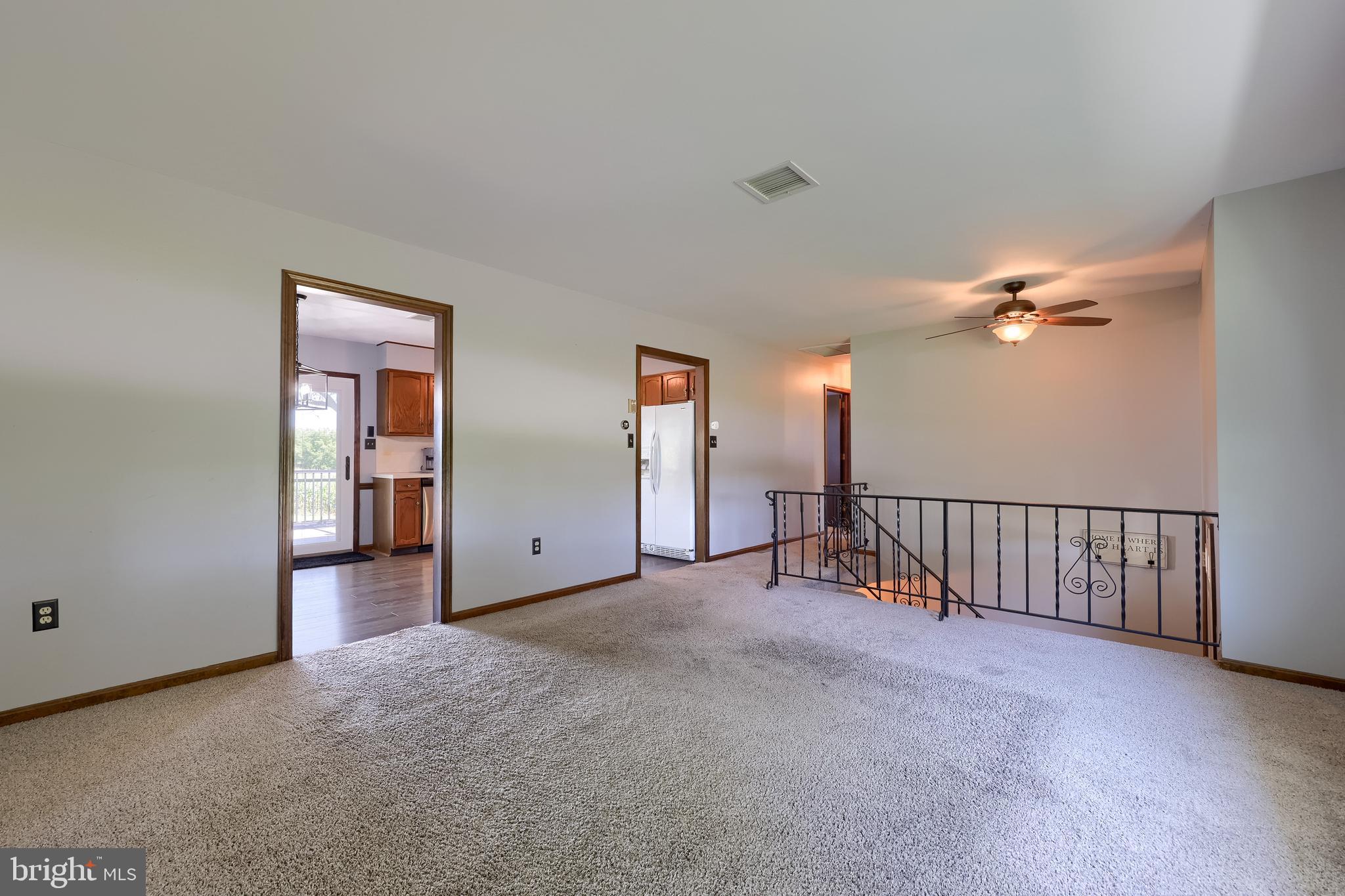 127 West Lexington Road Lititz, PA 17543 - Photo 9 of 48 a view of a livingroom with a ceiling fan and window