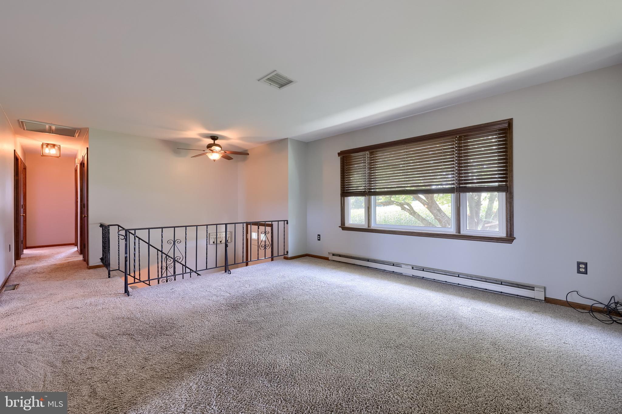 127 West Lexington Road Lititz, PA 17543 - Photo 10 of 48 an empty room with windows and ceiling fan