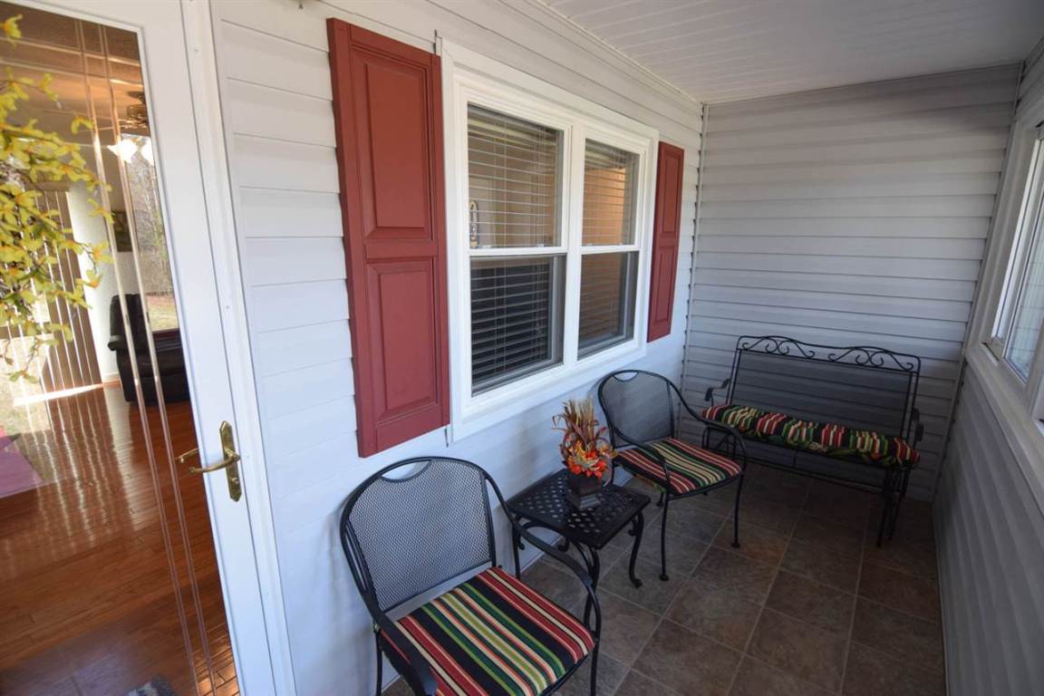 130 Apple Orchard Road Mountain Rest, SC 29664 - Photo 4 of 32 Comfortable front porch, enclosed for your conveni