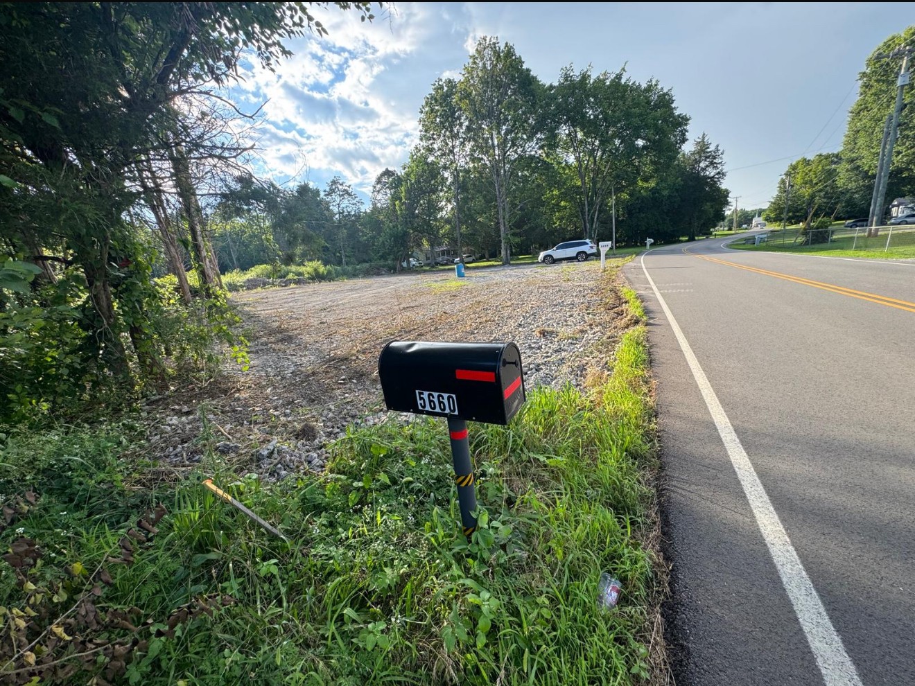 5660 Seminary Road Smyrna, TN 37167 - Photo 8 of 12 a sign board with flower plants and wooden fence