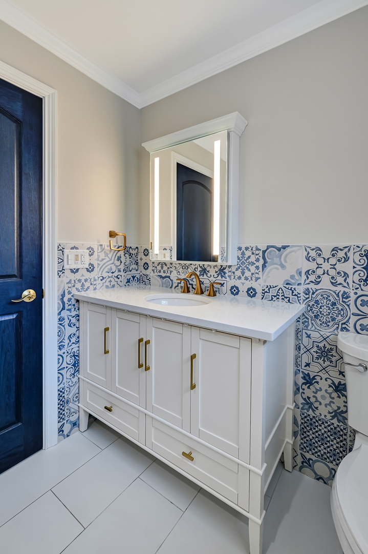 3220 Meyers Road Oak Brook, IL 60523 - Photo 18 of 43 a bathroom with a sink and a mirror