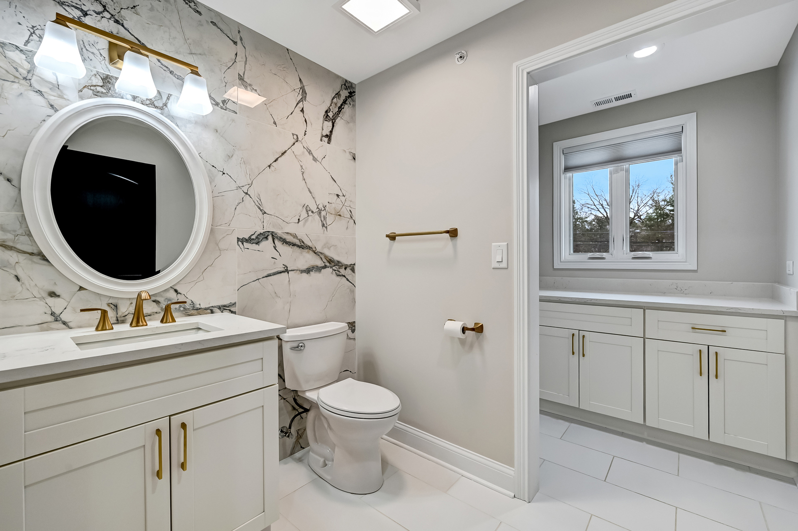3220 Meyers Road Oak Brook, IL 60523 - Photo 30 of 43 a bathroom with a sink vanity mirror and toilet