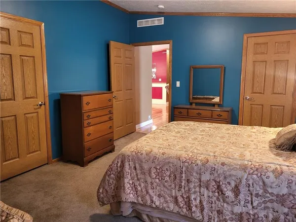 a bedroom with a bed and furniture