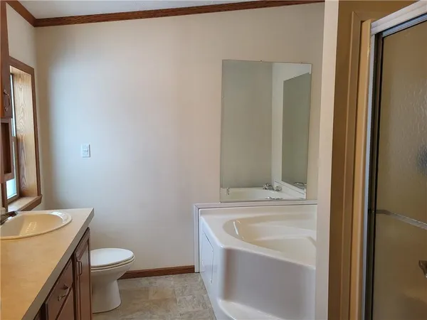 a bathroom with a sink toilet and vanity