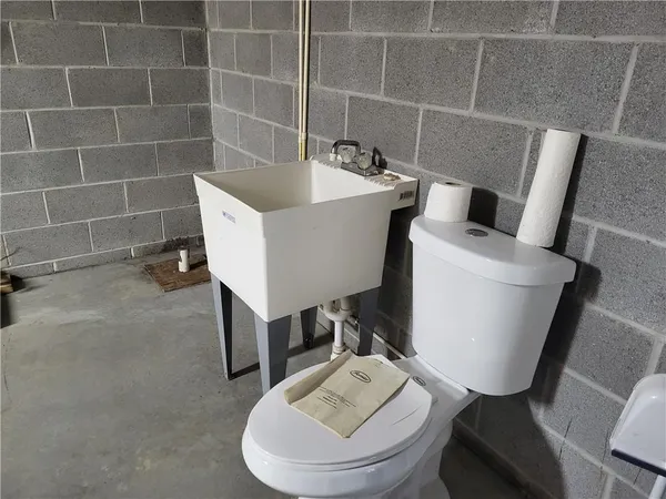 a bathroom with a sink and toilet